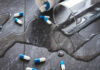 Antidepressants Are Major Drivers of Suicides Water is spilled and medical capsules are scattered