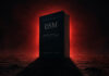 Let There Be Light: Before Psychiatry Writes Its Next DSM a thick textbook labeled "DSM" stands like the monolith from 2001, blocking a red glow from behind and casting a deep shadow